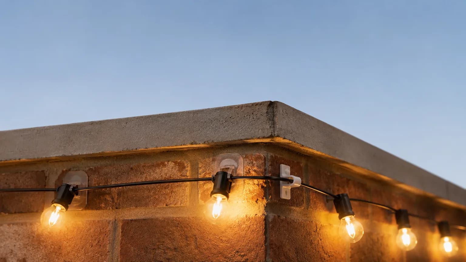 How to Hang Christmas Lights on Brick & Stucco Without Nails (2026 Guide)